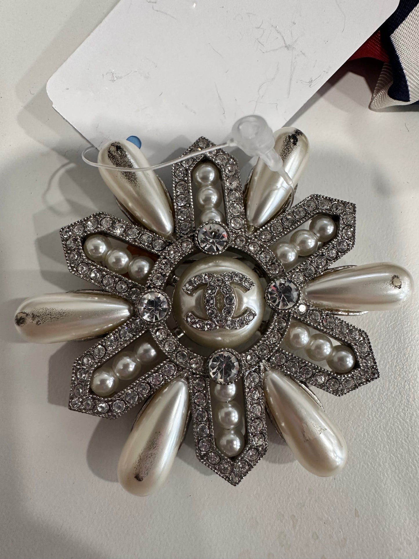 Chanel scarf and Chanel brooch