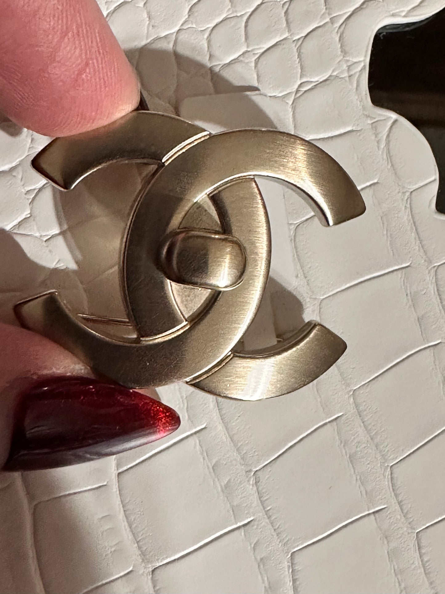 Chanel turnlock brooch